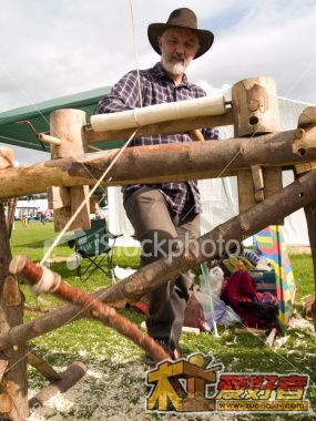 ist2_3917644-woodwork-craftsman-working-a-pole-lathe.jpg